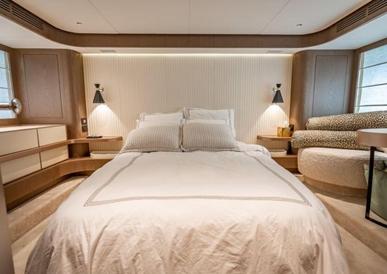 a bed with white sheets aboard AZIMUT MAGELLANO 30/15 Yacht for Sale
