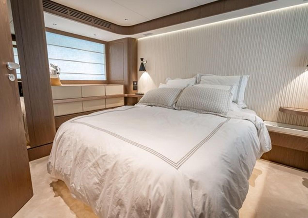 a bed with white sheets aboard AZIMUT MAGELLANO 30/15 Yacht for Sale