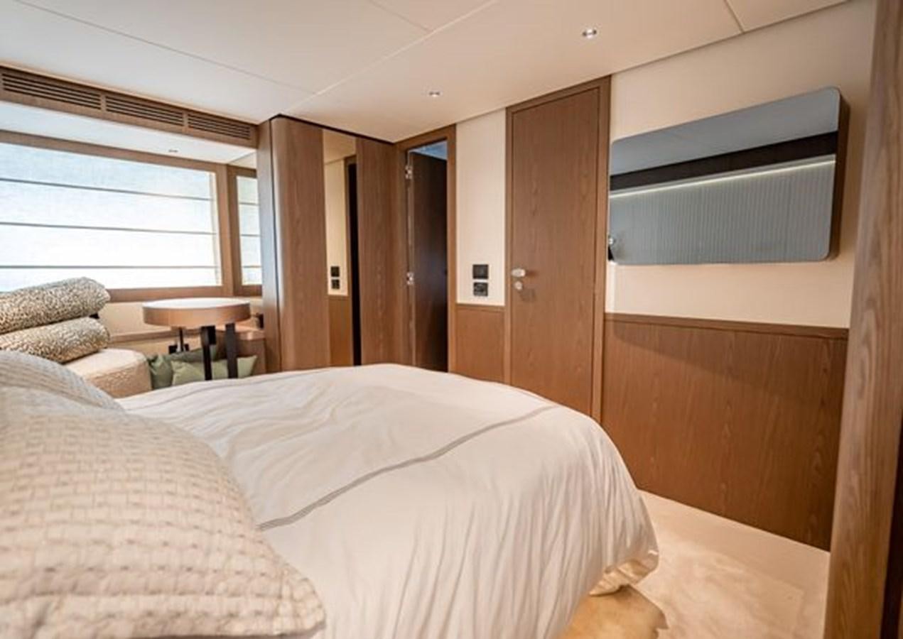 a bedroom with a bed and a television aboard AZIMUT MAGELLANO 30/15 Yacht for Sale
