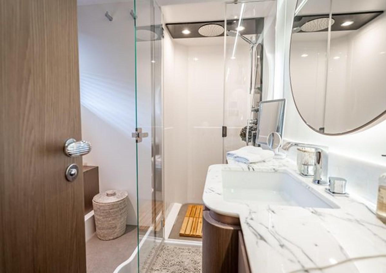 a bathroom with a shower and sink aboard AZIMUT MAGELLANO 30/15 Yacht for Sale