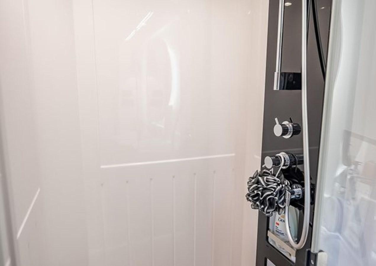 a black and silver door handle aboard AZIMUT MAGELLANO 30/15 Yacht for Sale