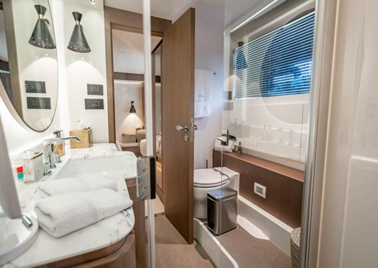 a bathroom with a tub sink and toilet aboard AZIMUT MAGELLANO 30/15 Yacht for Sale