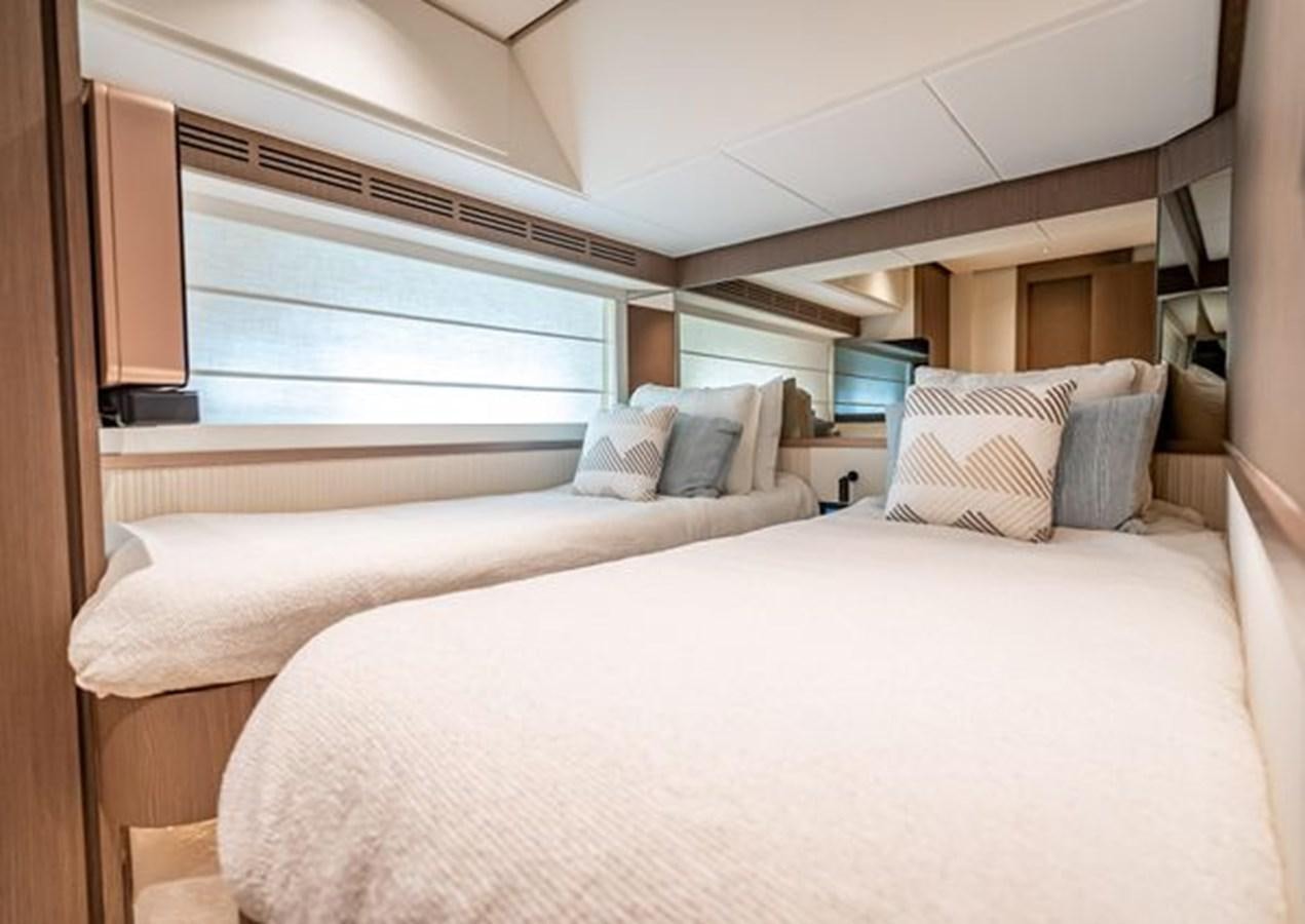 a room with two beds aboard AZIMUT MAGELLANO 30/15 Yacht for Sale