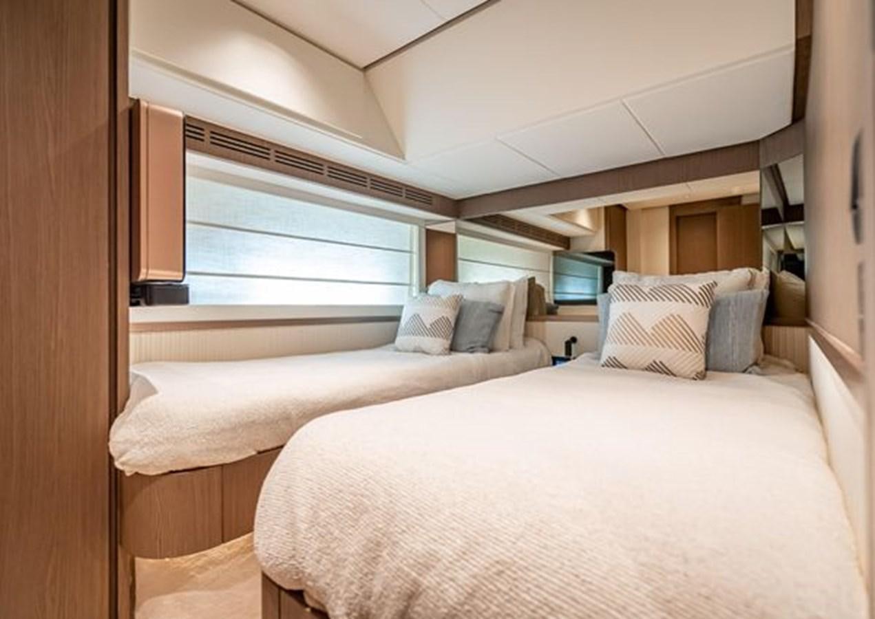 a room with two beds aboard AZIMUT MAGELLANO 30/15 Yacht for Sale