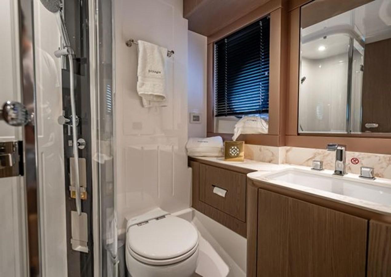 a bathroom with a sink toilet and a shower unit aboard AZIMUT MAGELLANO 30/15 Yacht for Sale