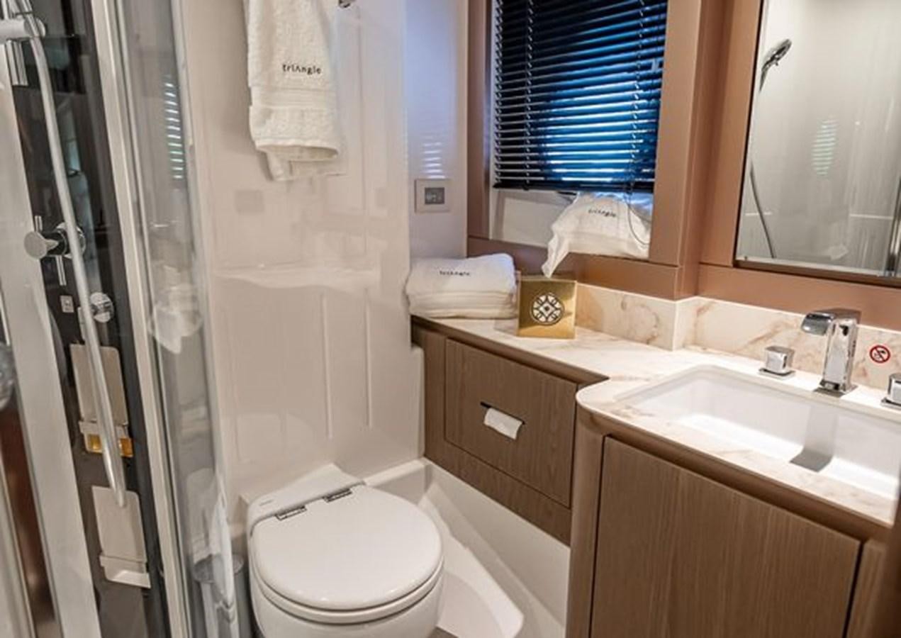 a bathroom with a shower curtain aboard AZIMUT MAGELLANO 30/15 Yacht for Sale