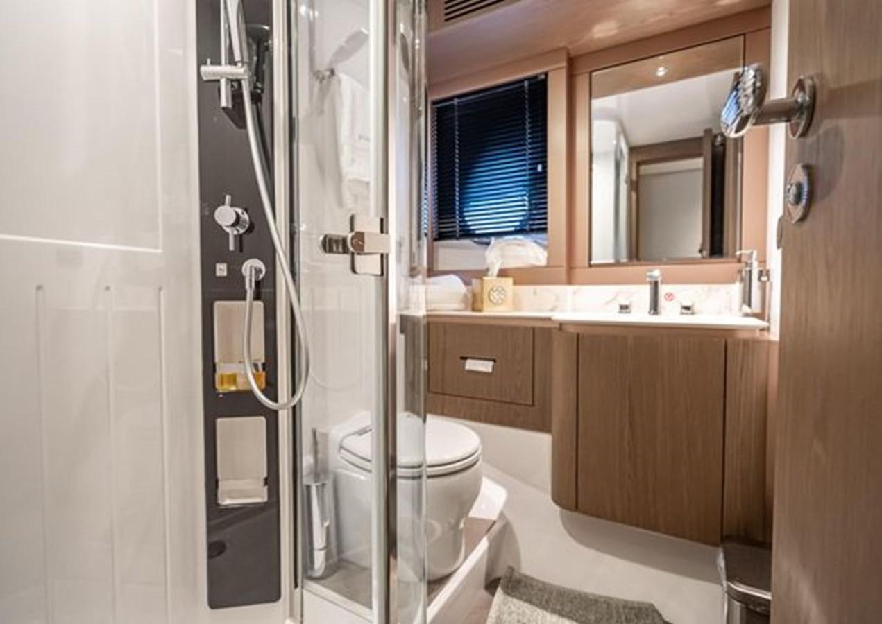 a bathroom with a glass shower aboard AZIMUT MAGELLANO 30/15 Yacht for Sale