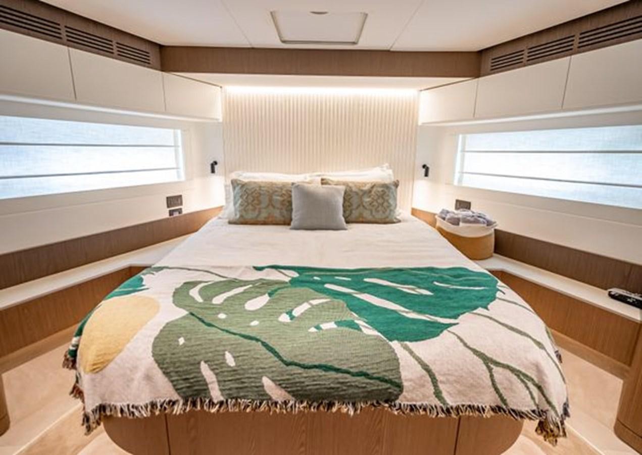a bed with a green sheet aboard AZIMUT MAGELLANO 30/15 Yacht for Sale