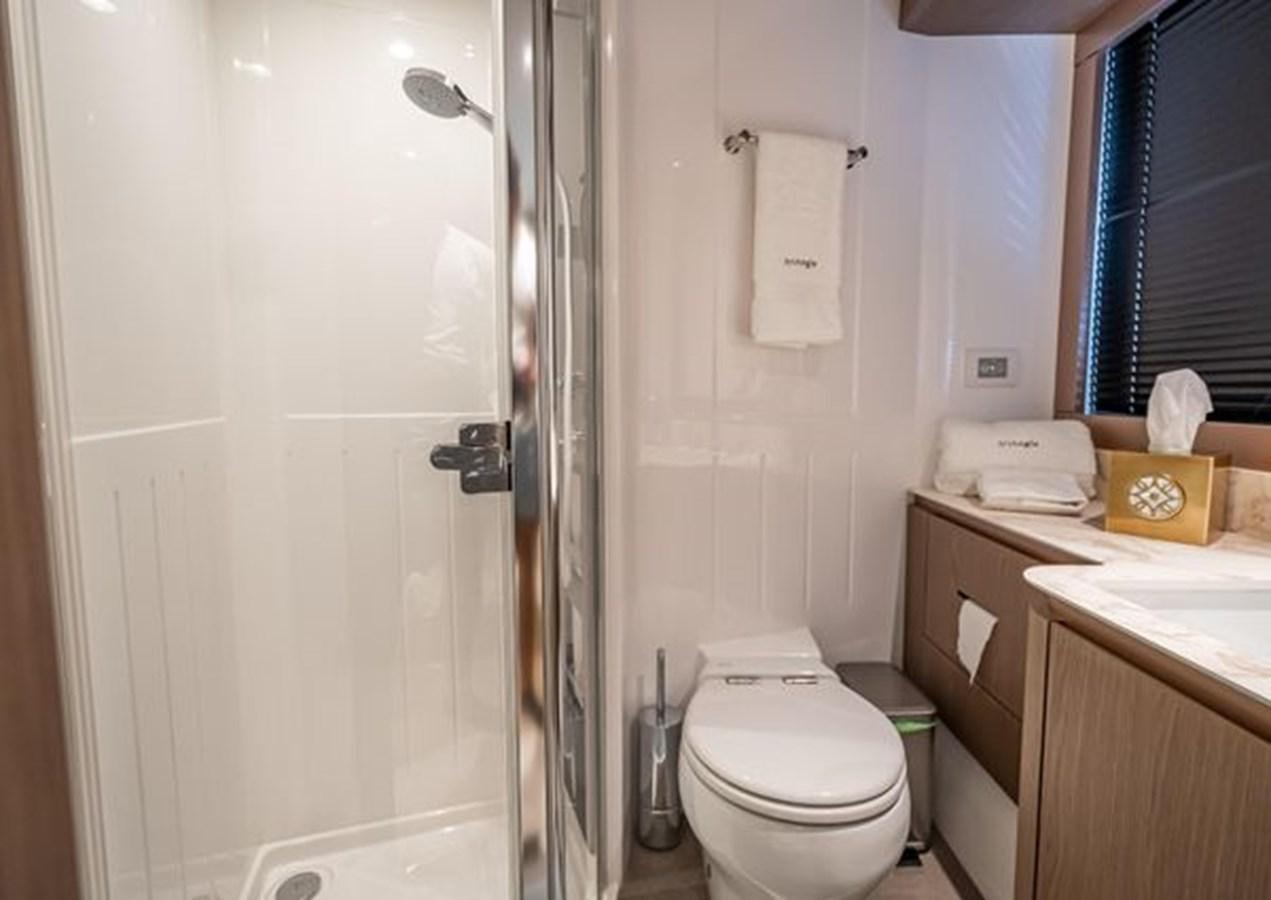 a bathroom with a toilet and a sink aboard AZIMUT MAGELLANO 30/15 Yacht for Sale