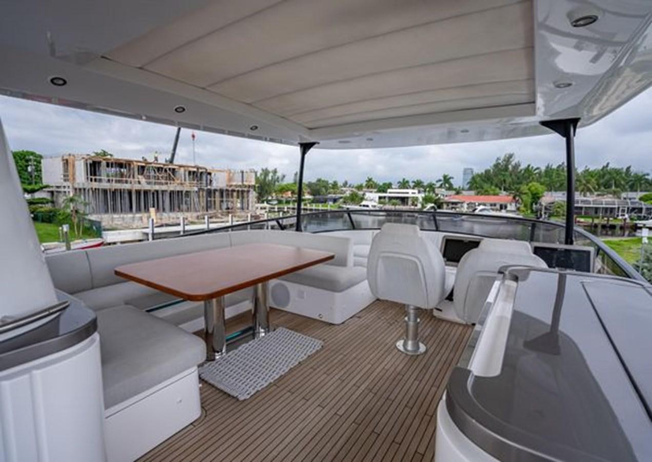 a room with a table and chairs aboard AZIMUT MAGELLANO 30/15 Yacht for Sale