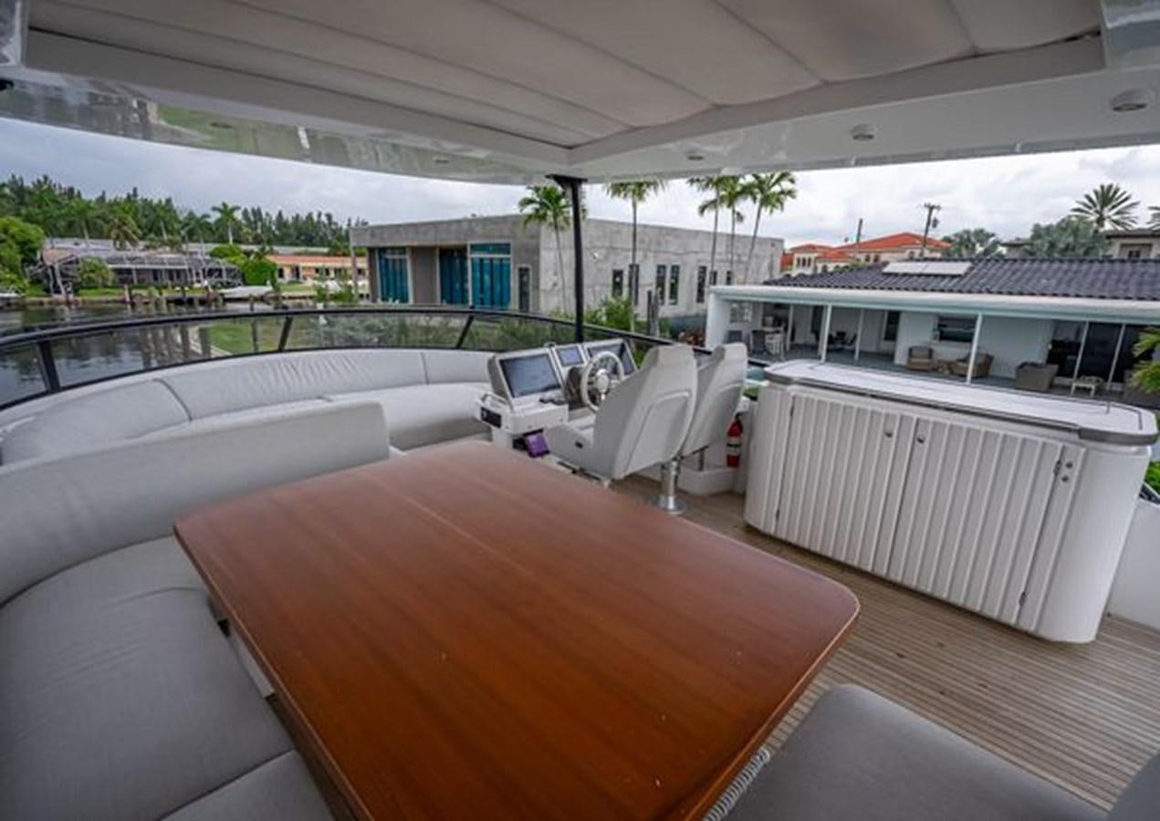 a room with a table and chairs aboard AZIMUT MAGELLANO 30/15 Yacht for Sale
