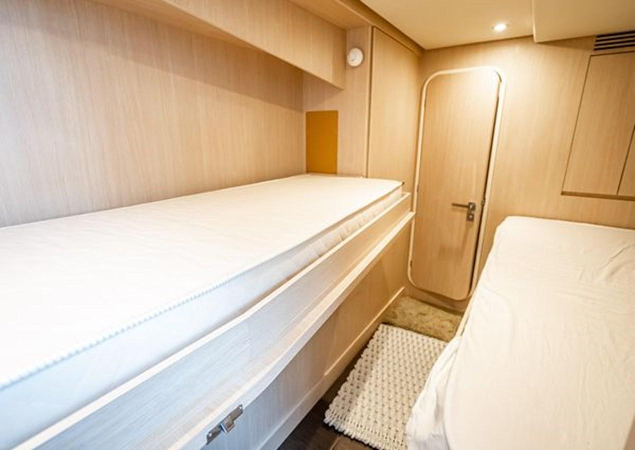 a room with a bed and a closet aboard AZIMUT MAGELLANO 30/15 Yacht for Sale