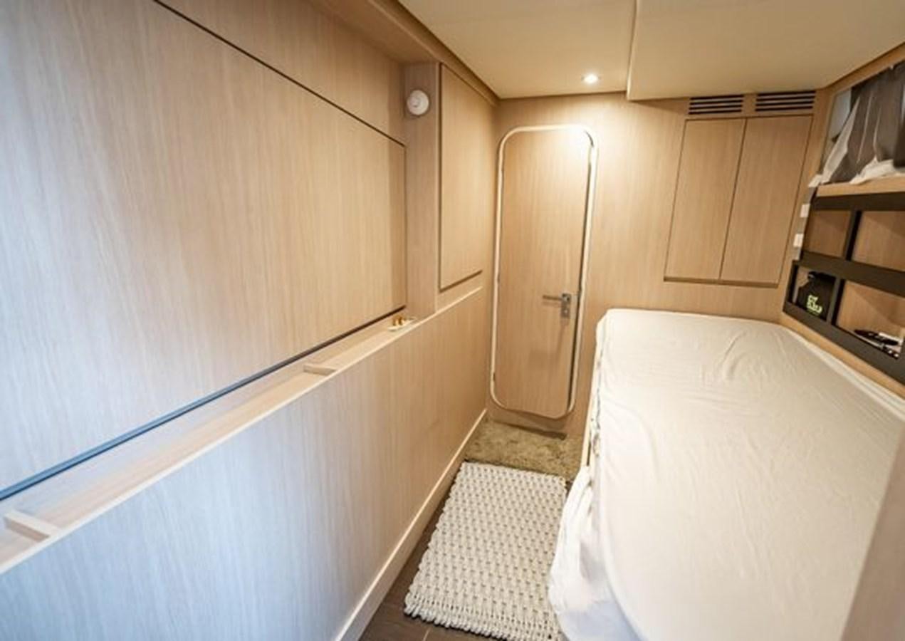 a bedroom with a bed and a closet aboard AZIMUT MAGELLANO 30/15 Yacht for Sale