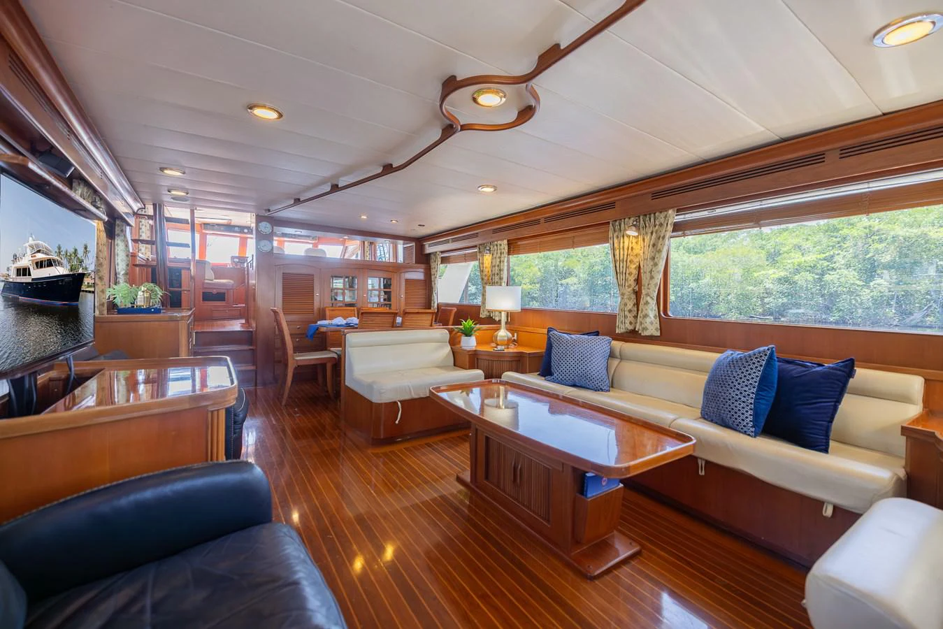 a living room with a couch and a table aboard THE GARLIC Yacht for Sale