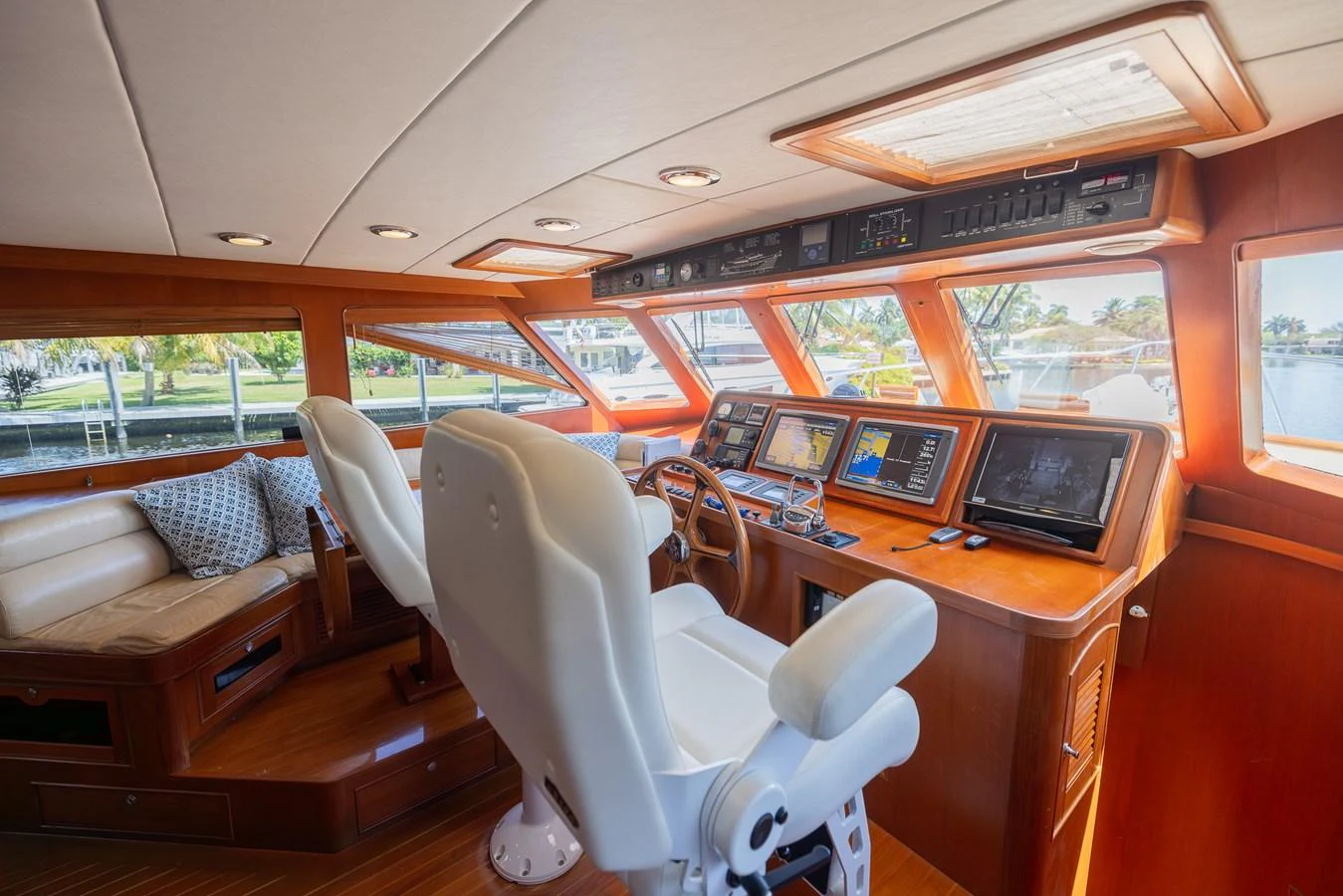 a train car with a desk and chairs aboard THE GARLIC Yacht for Sale