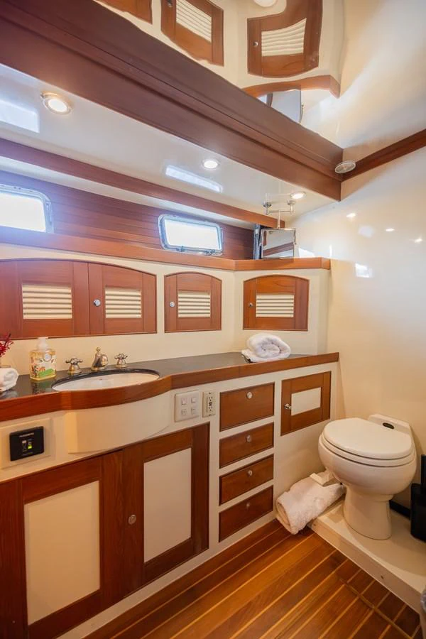a bathroom with a sink and a toilet aboard THE GARLIC Yacht for Sale