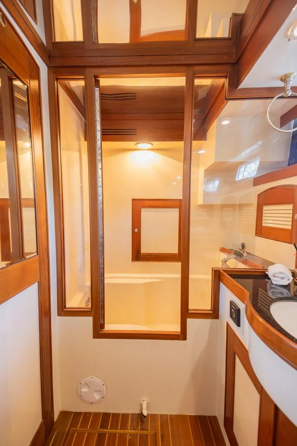 a bathroom with a mirror aboard THE GARLIC Yacht for Sale