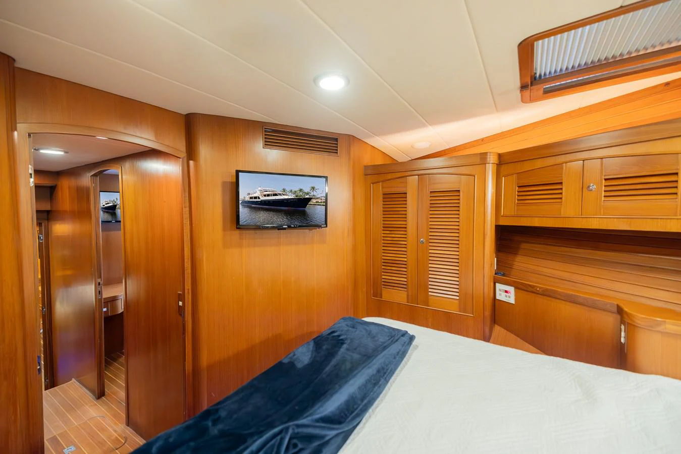 a room with a bed and a closet aboard THE GARLIC Yacht for Sale