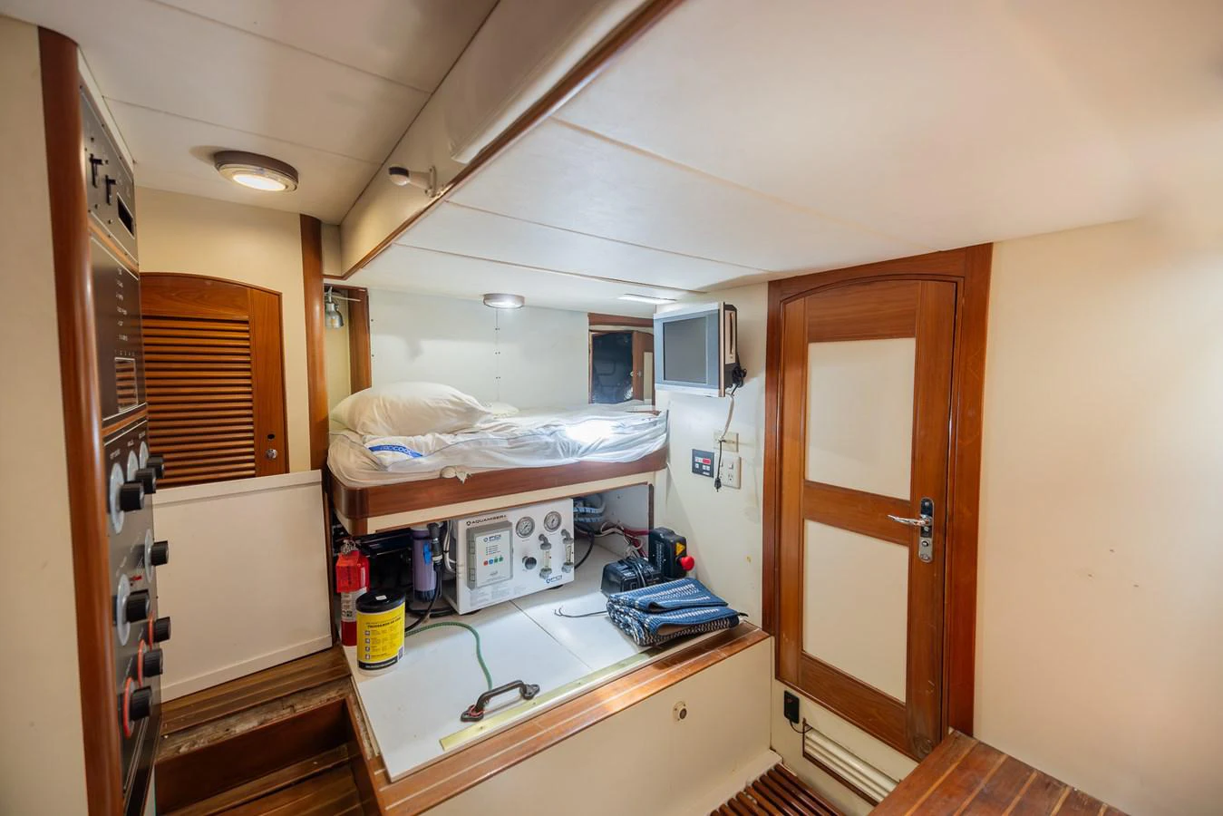 a room with a bed and a desk aboard THE GARLIC Yacht for Sale