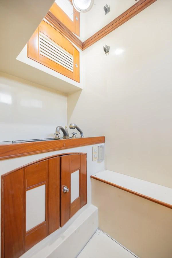 a bathroom with a sink and cabinets aboard THE GARLIC Yacht for Sale