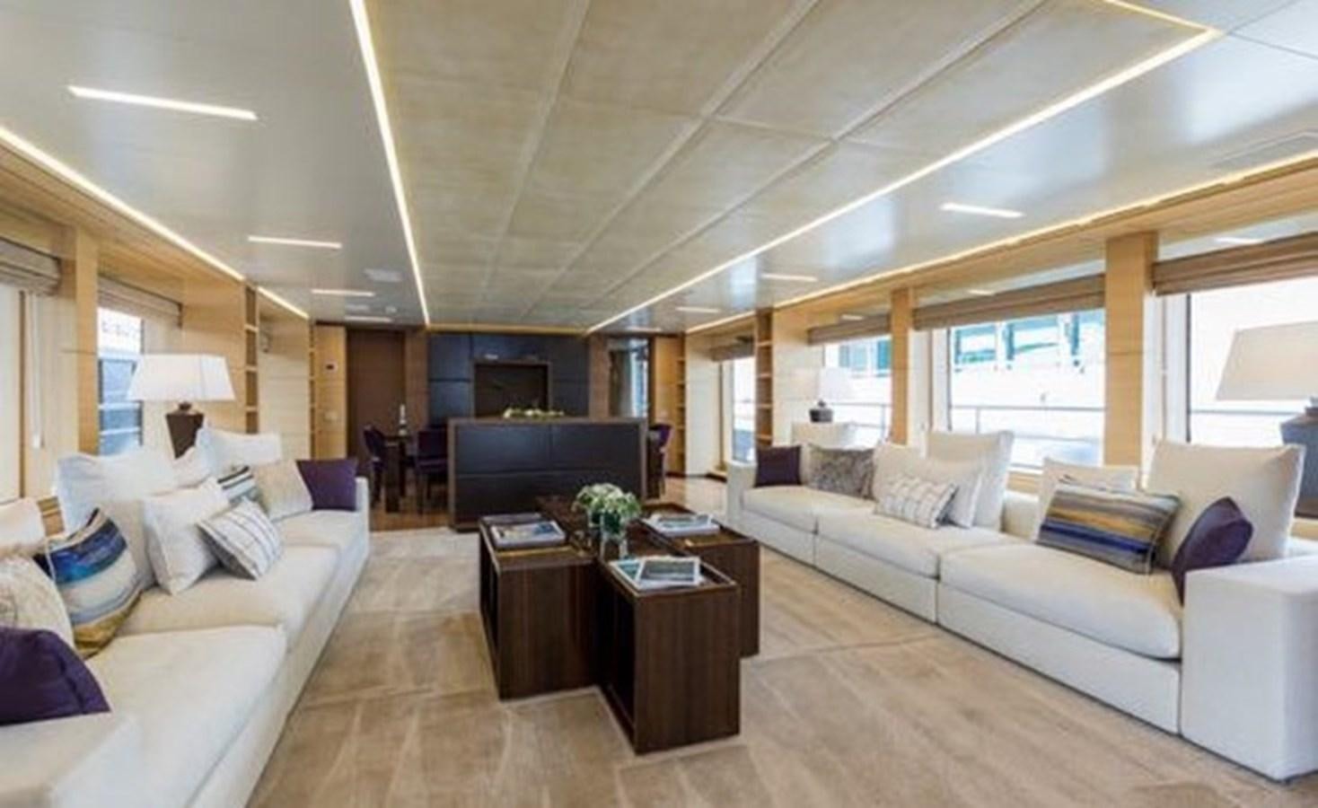 a living room with a couch and a tv aboard BENETTI 132 Yacht for Sale