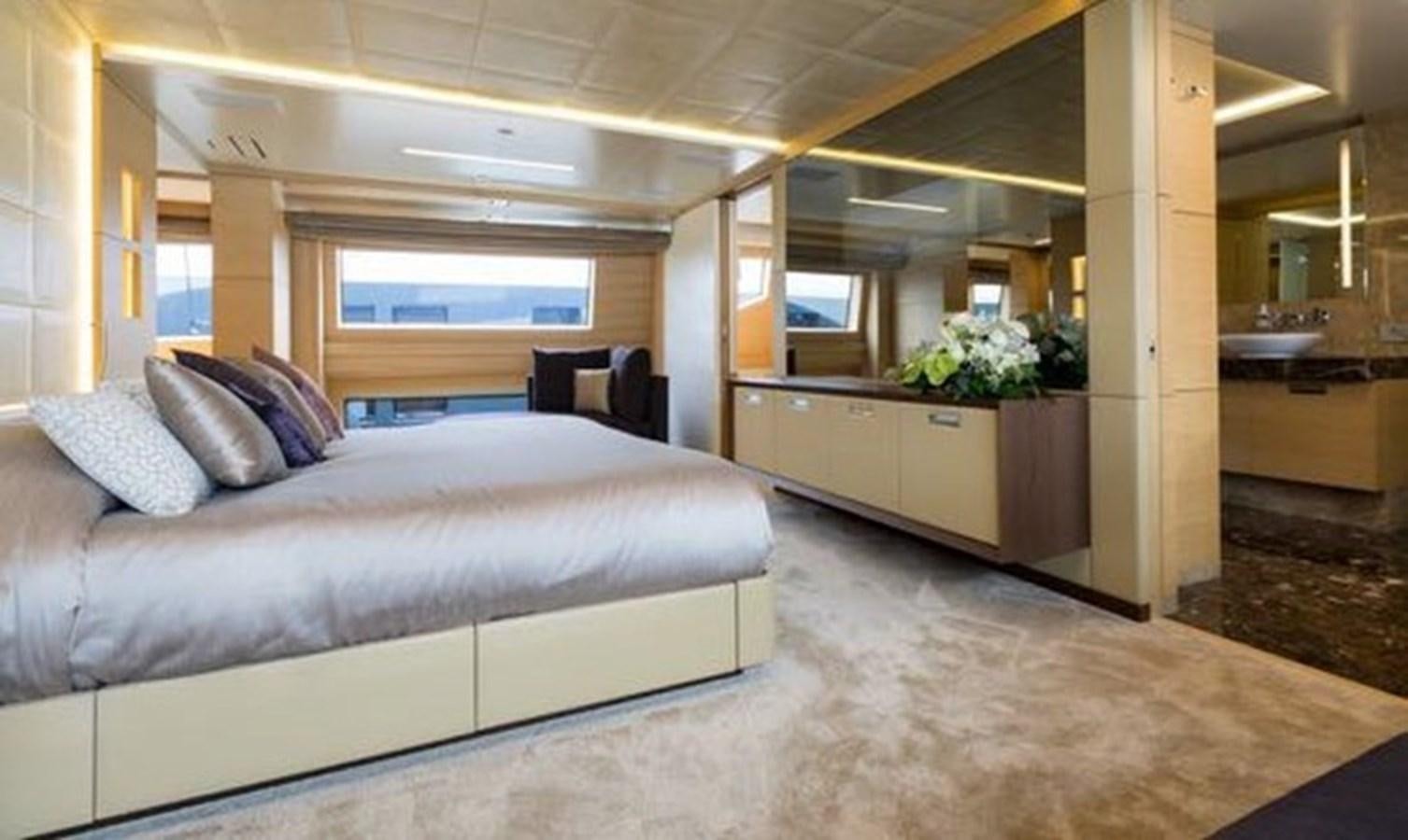 a large bedroom with a large bed aboard BENETTI 132 Yacht for Sale