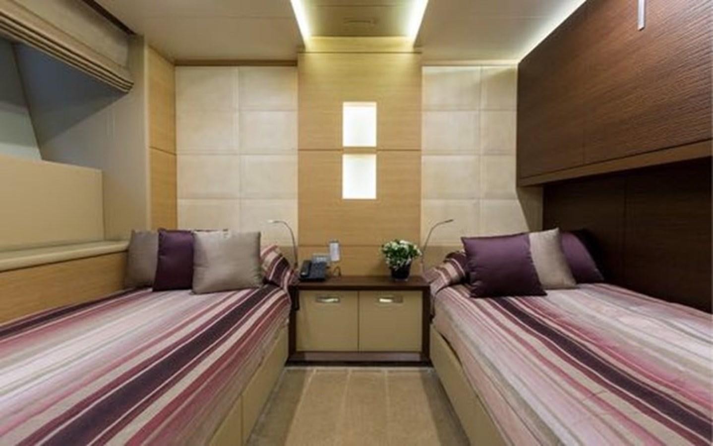 a room with two beds aboard BENETTI 132 Yacht for Sale