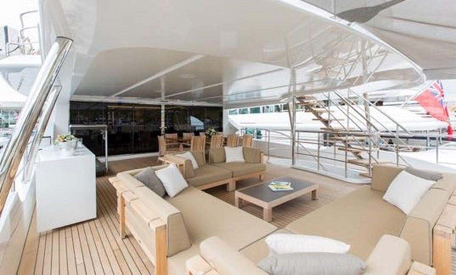a room with a couch and a table aboard BENETTI 132 Yacht for Sale
