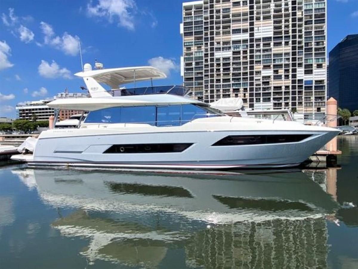 a white yacht in a harbor aboard 2016 PRESTIGE 680 FLY Yacht for Sale