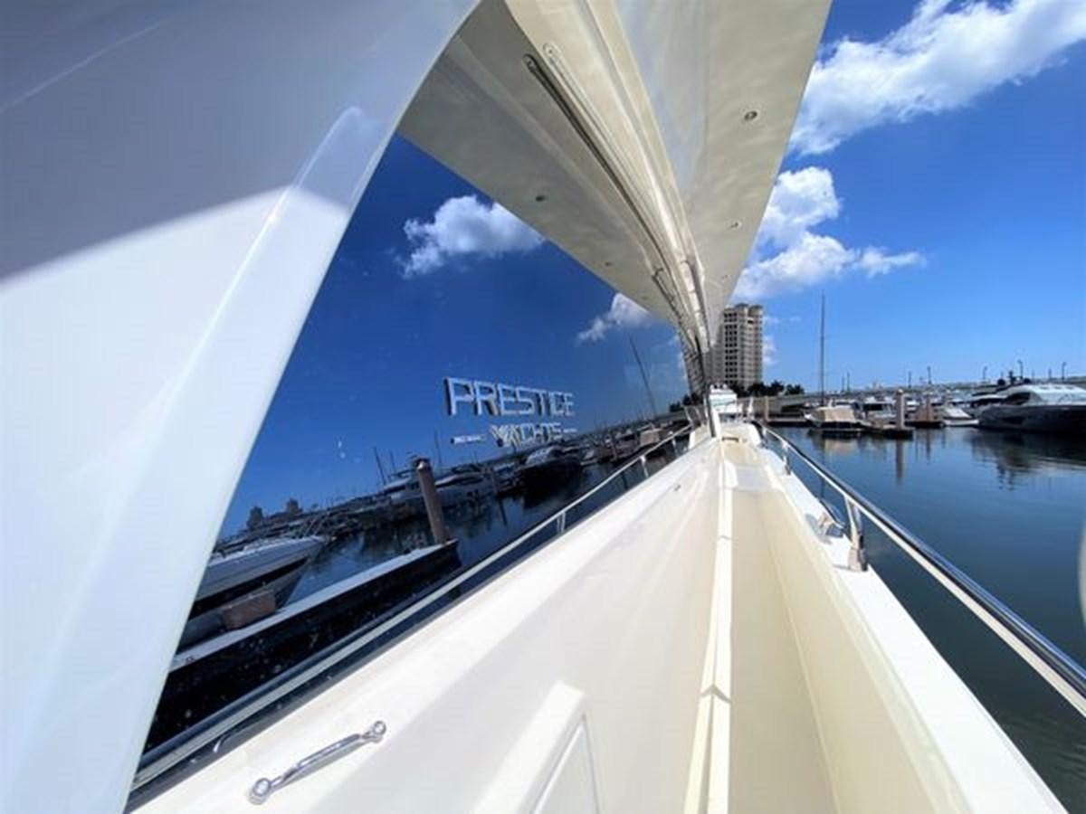 a large white boat on a body of water aboard 2016 PRESTIGE 680 FLY Yacht for Sale