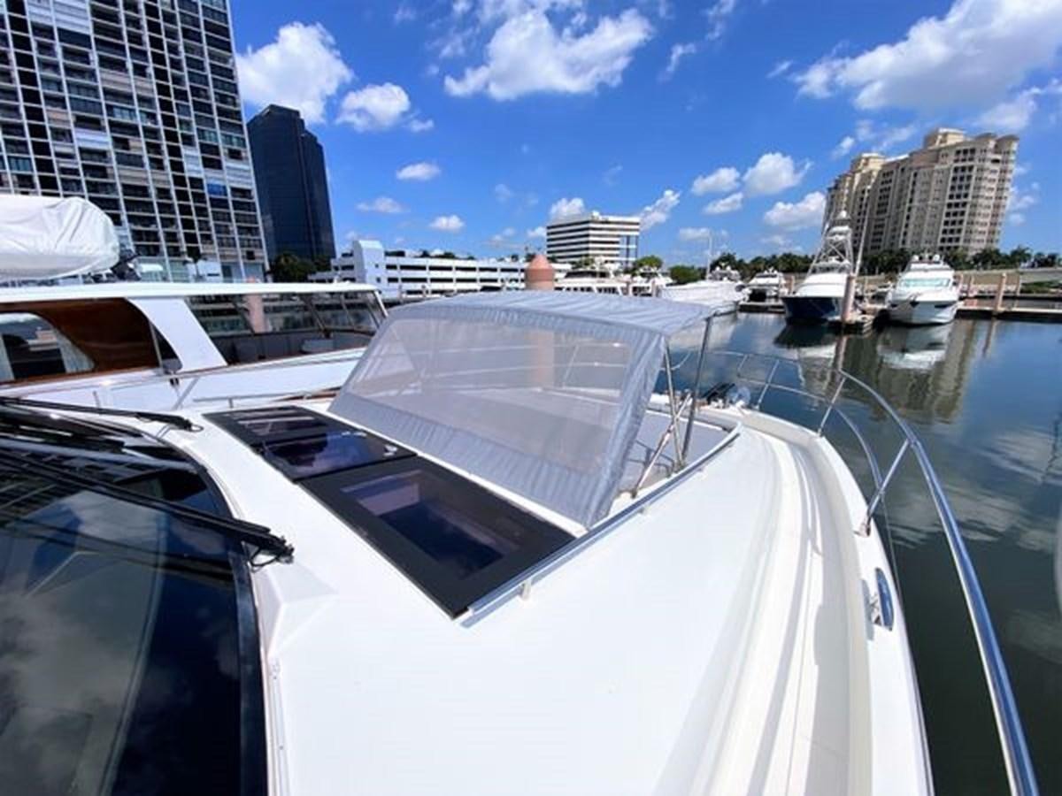 a boat in a harbor aboard 2016 PRESTIGE 680 FLY Yacht for Sale