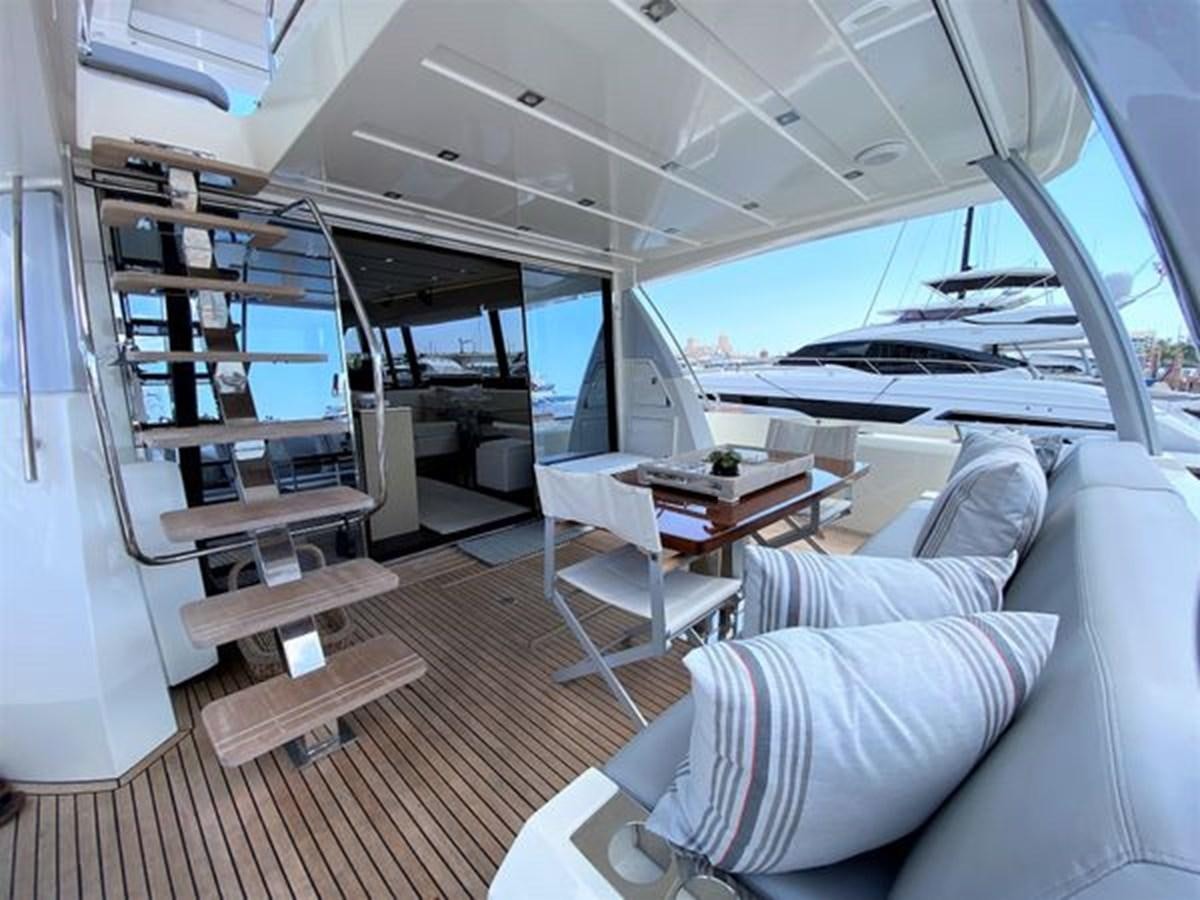 a room with a large window and a bed aboard 2016 PRESTIGE 680 FLY Yacht for Sale