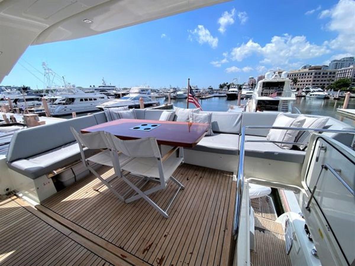a deck with a boat and chairs on it aboard 2016 PRESTIGE 680 FLY Yacht for Sale