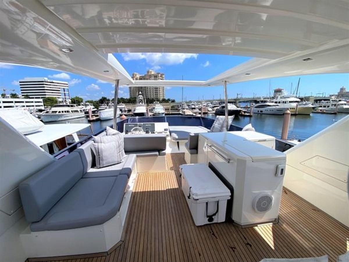 a boat deck with a deck and chairs on it aboard 2016 PRESTIGE 680 FLY Yacht for Sale