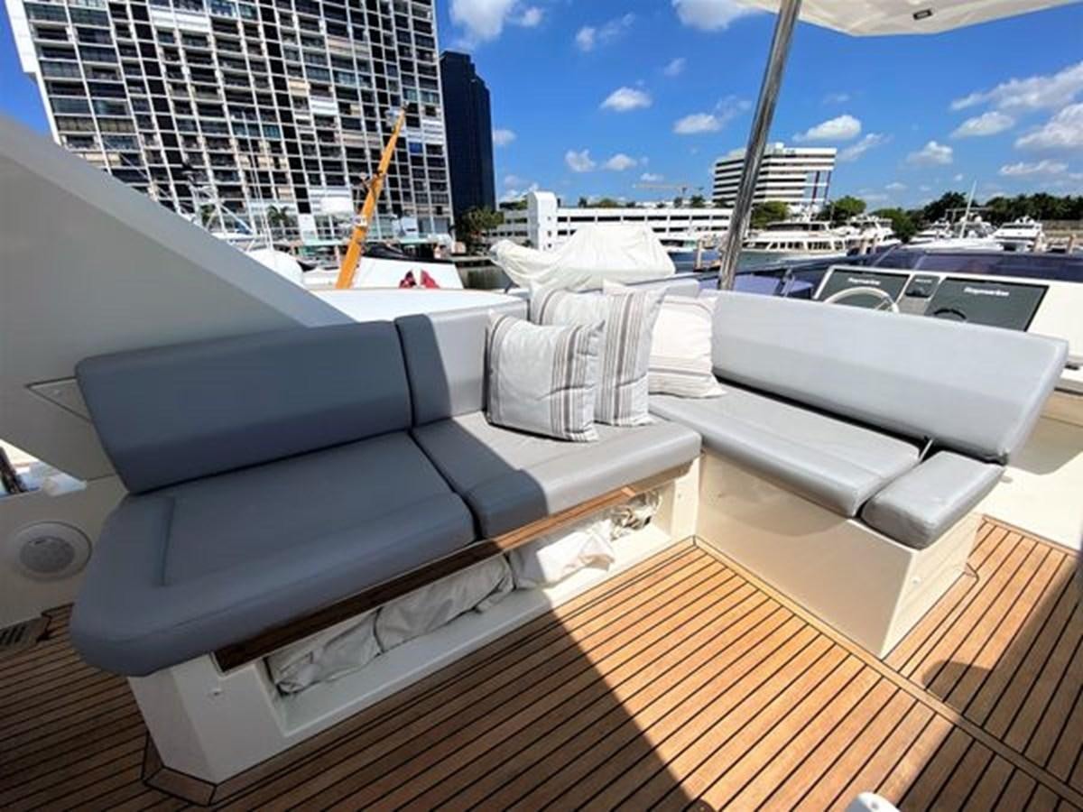 a room with a large bed and a large window aboard 2016 PRESTIGE 680 FLY Yacht for Sale