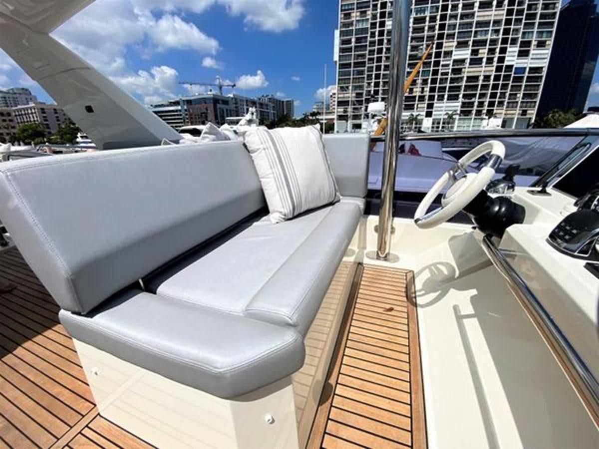 a white couch on a boat aboard 2016 PRESTIGE 680 FLY Yacht for Sale
