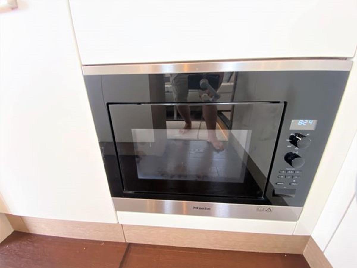 a tv on a shelf aboard 2016 PRESTIGE 680 FLY Yacht for Sale