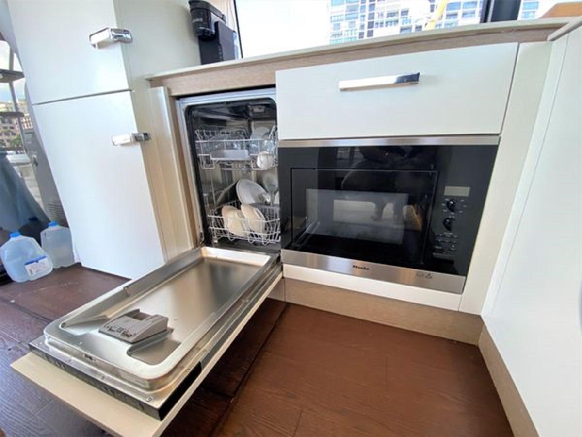 a kitchen with a microwave oven aboard 2016 PRESTIGE 680 FLY Yacht for Sale