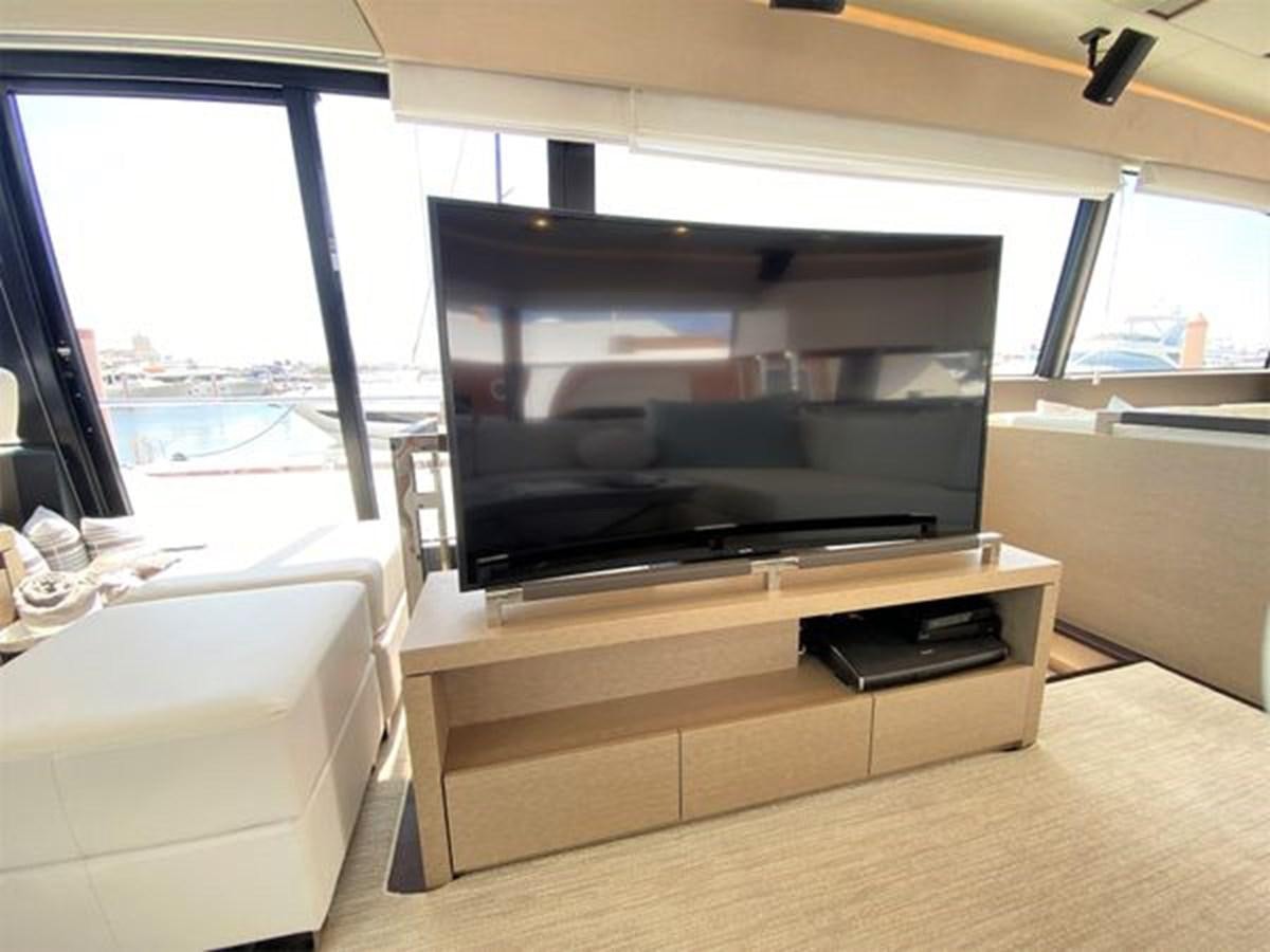 a tv on a stand aboard 2016 PRESTIGE 680 FLY Yacht for Sale