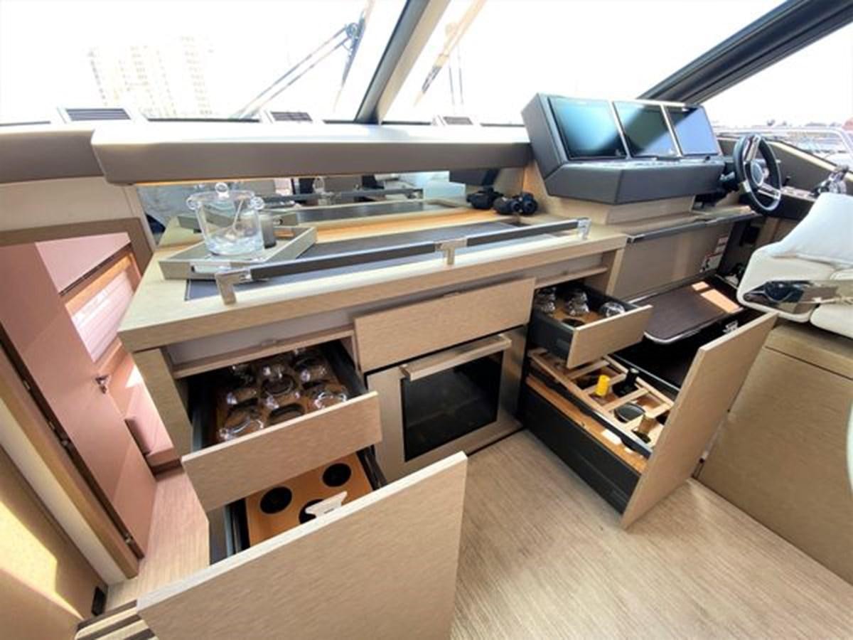 a kitchen with a large oven and a microwave aboard 2016 PRESTIGE 680 FLY Yacht for Sale
