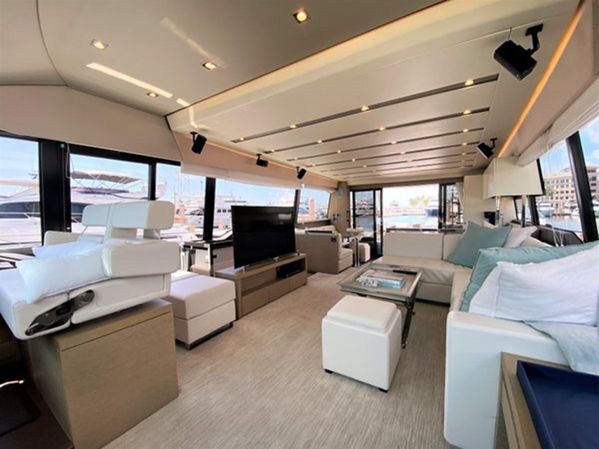 a room with a bed and a television aboard 2016 PRESTIGE 680 FLY Yacht for Sale