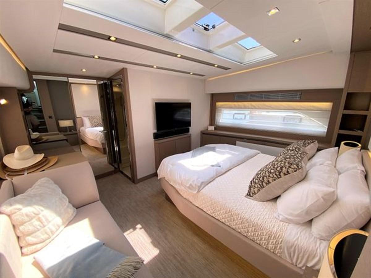 a hotel room with a bed aboard 2016 PRESTIGE 680 FLY Yacht for Sale