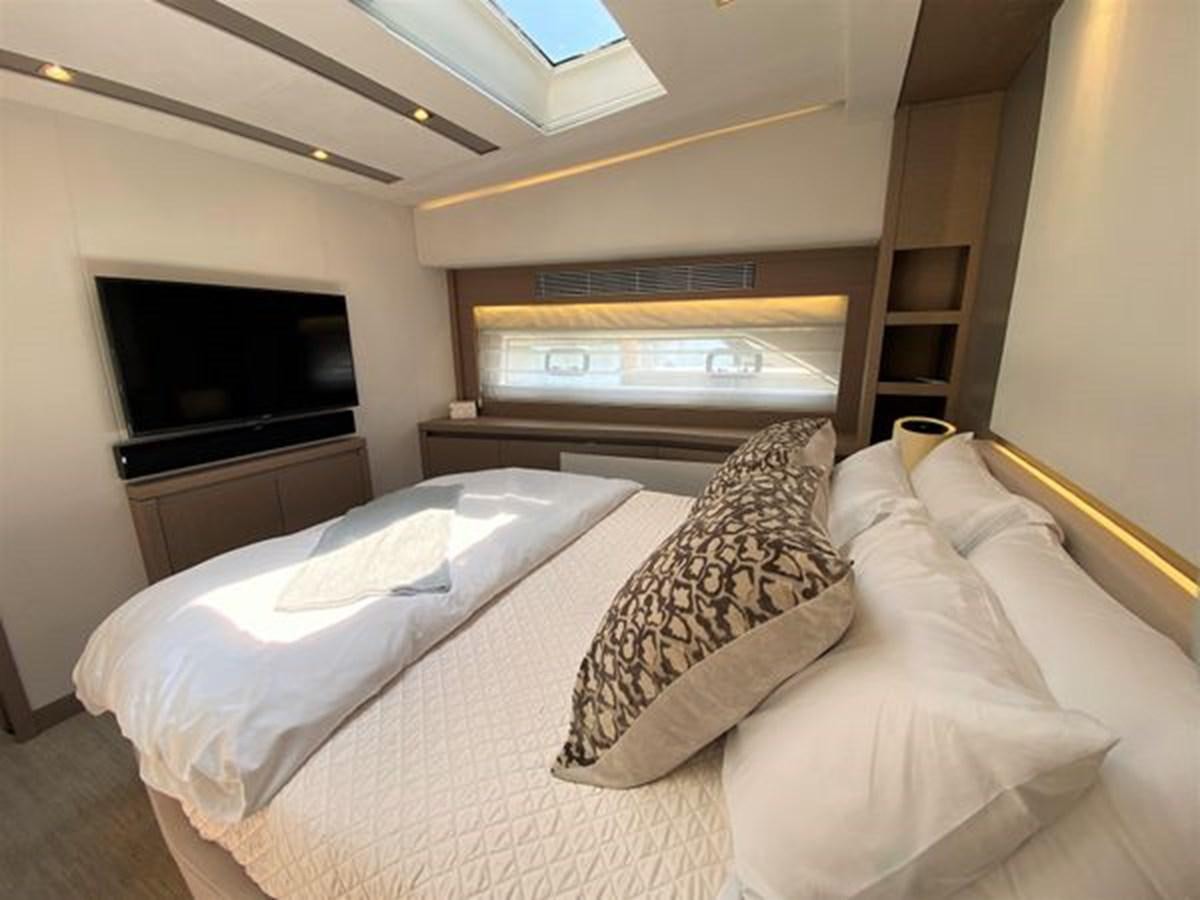 a room with two beds aboard 2016 PRESTIGE 680 FLY Yacht for Sale