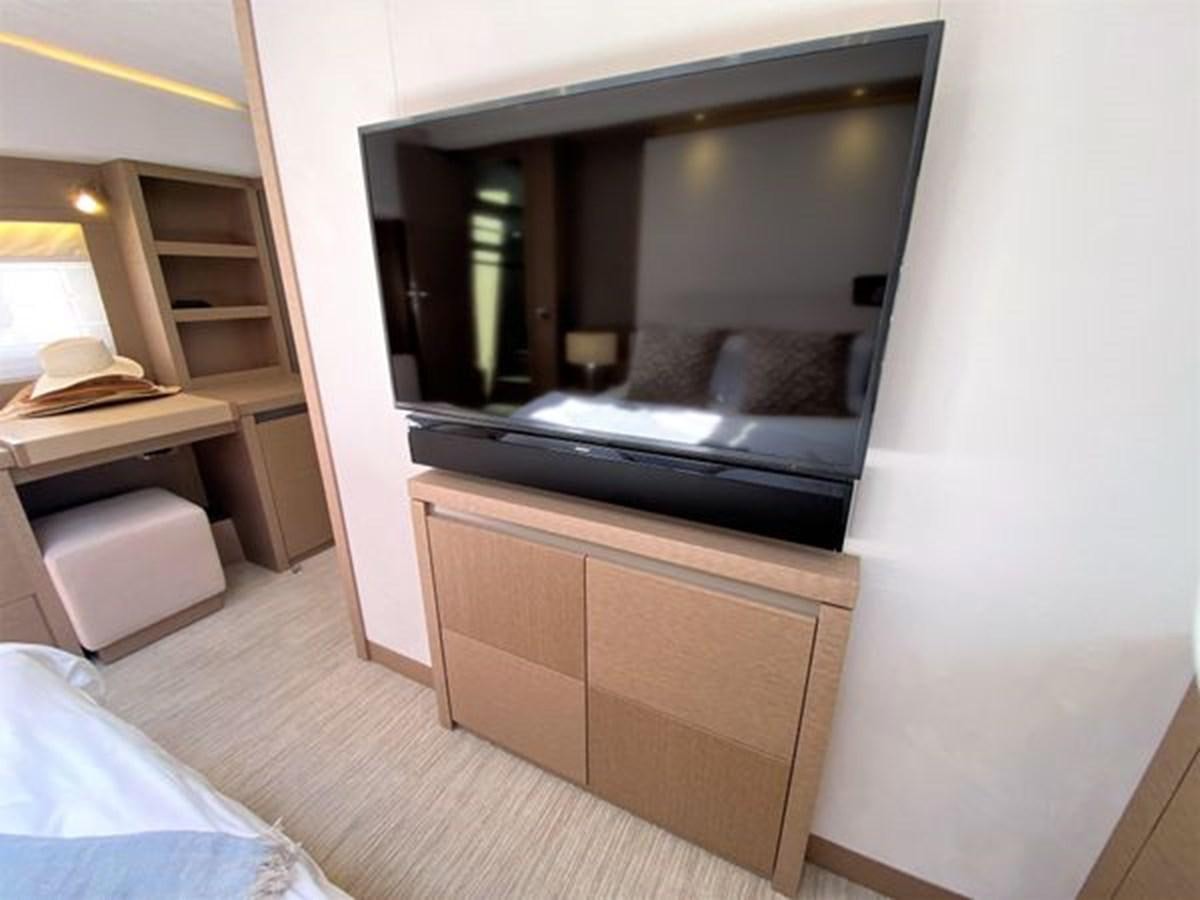 a mirror above a desk aboard 2016 PRESTIGE 680 FLY Yacht for Sale