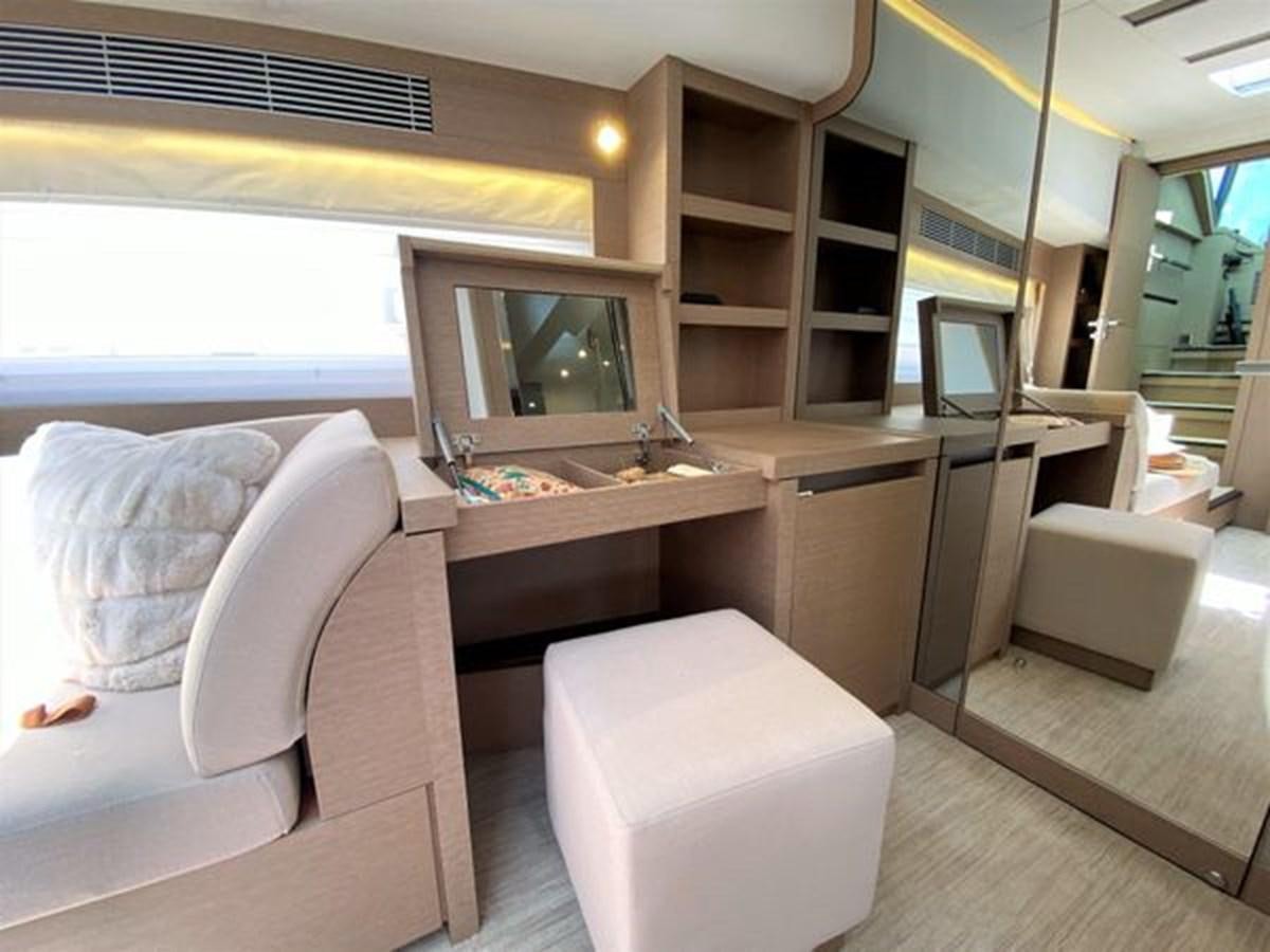 a room with a bed and a television aboard 2016 PRESTIGE 680 FLY Yacht for Sale