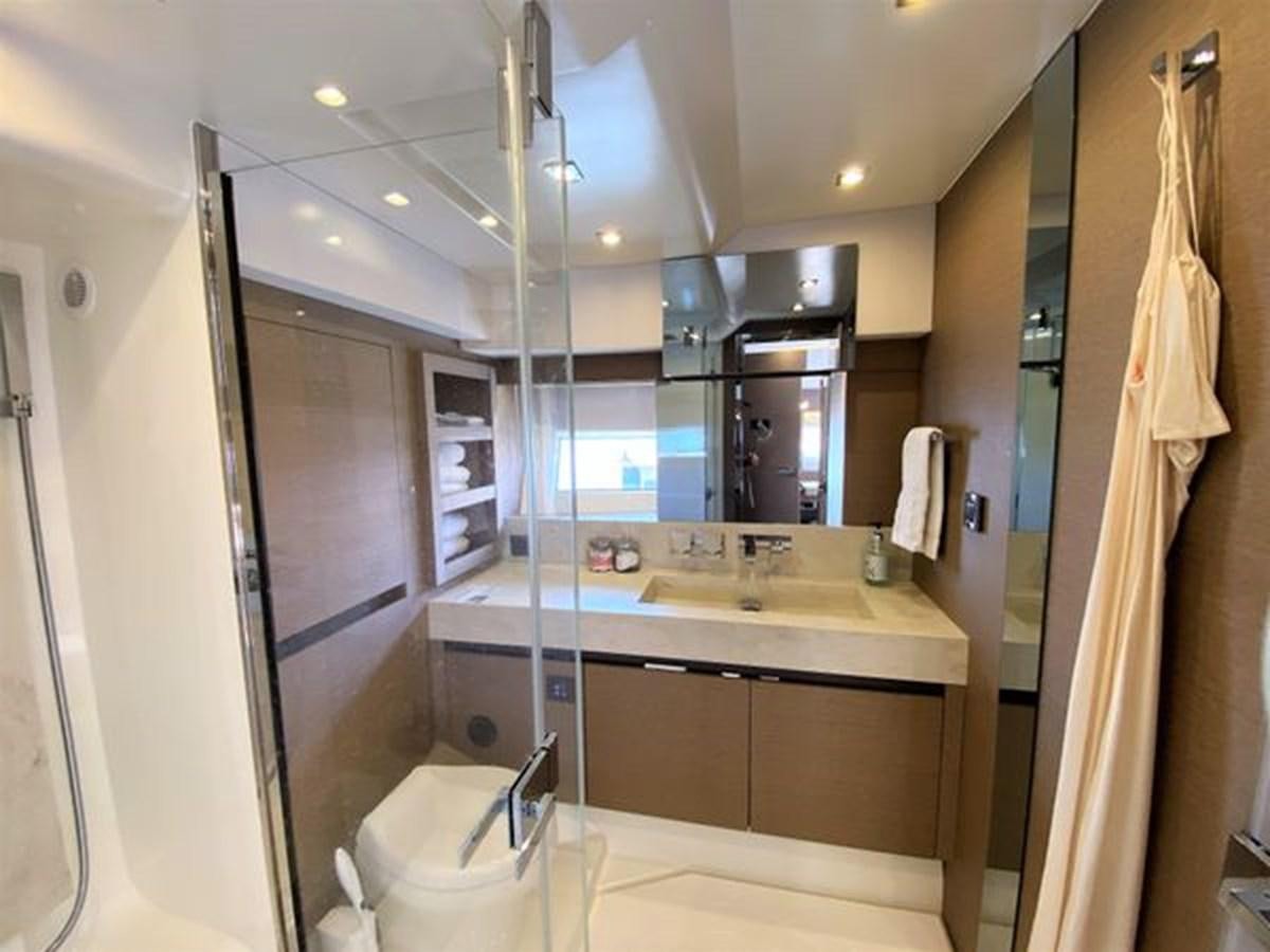 a bathroom with a sink and a mirror aboard 2016 PRESTIGE 680 FLY Yacht for Sale