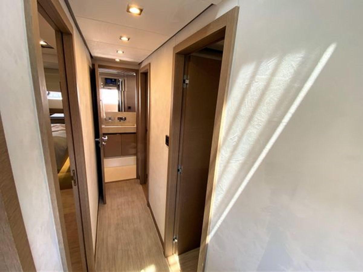 a hallway with doors aboard 2016 PRESTIGE 680 FLY Yacht for Sale
