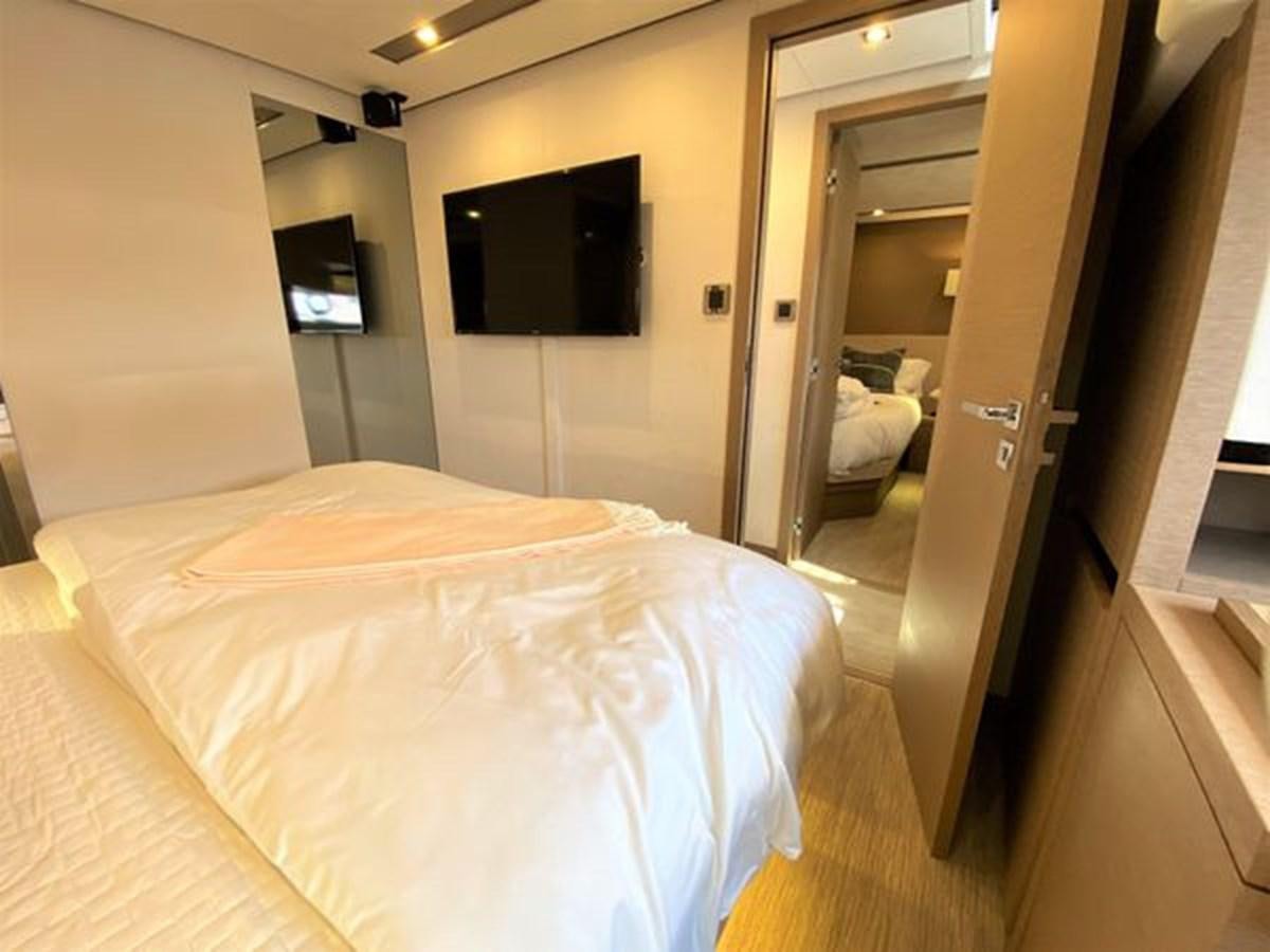 a hotel room with a bed aboard 2016 PRESTIGE 680 FLY Yacht for Sale