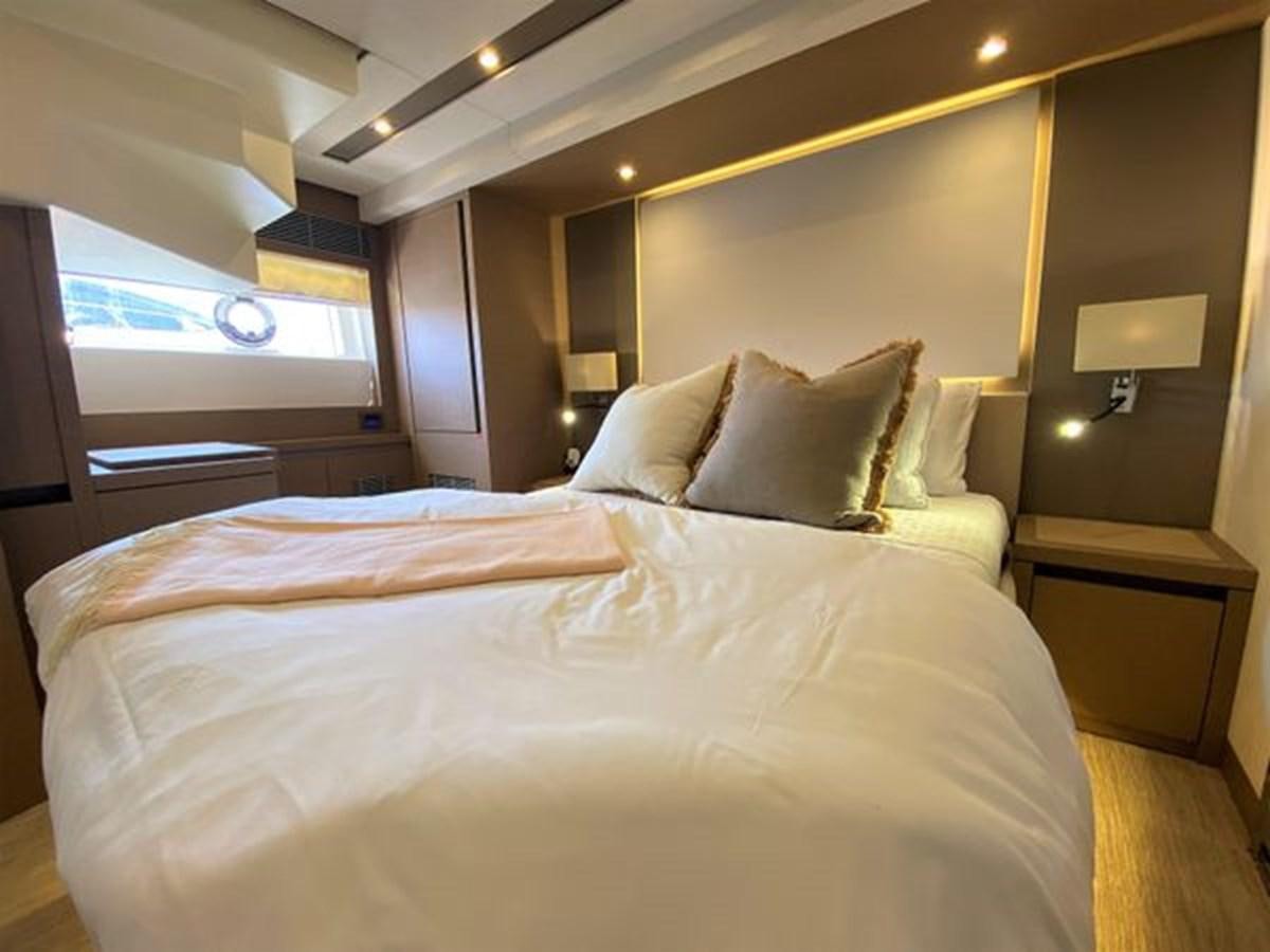 a bed with white sheets aboard 2016 PRESTIGE 680 FLY Yacht for Sale