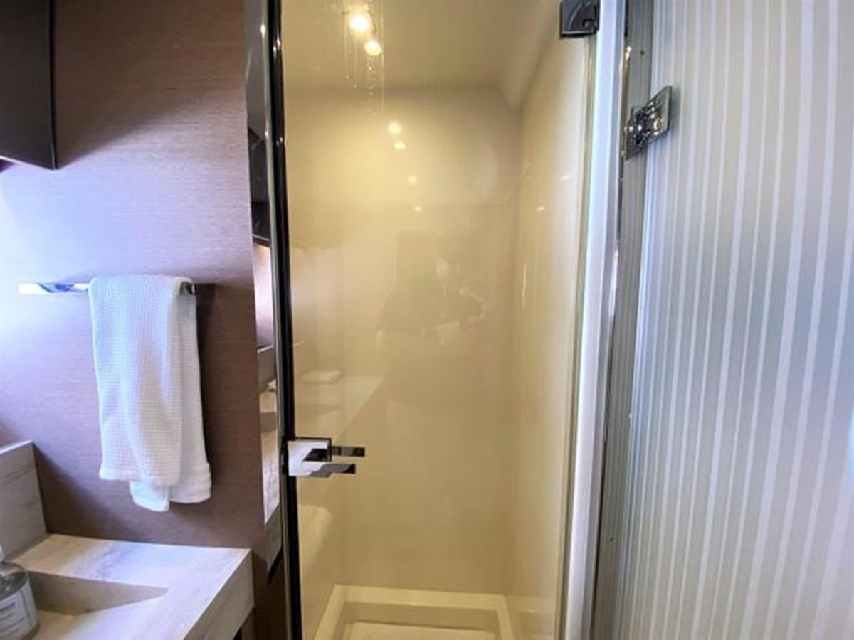 a bathroom with a shower and a sink aboard 2016 PRESTIGE 680 FLY Yacht for Sale